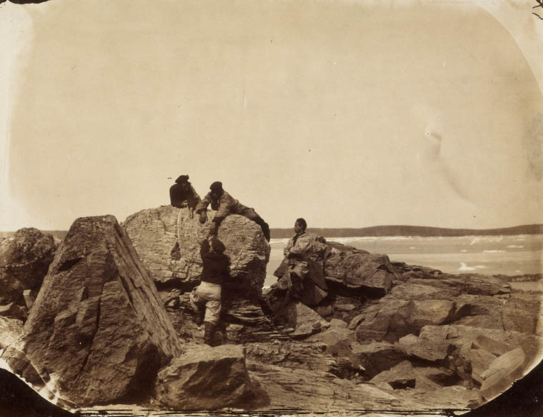 French fishermen climbing rocks (north of Newfoundland)