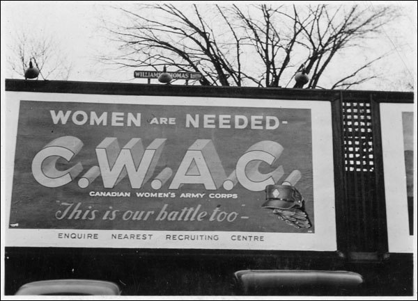 View of an outdoor billboard for the Canadian Women's Army Corps: "Women are needed - C.W.A.C. - This is our battle too