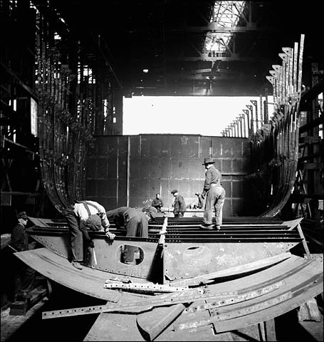 Workmen in the Canadian Vickers yard constructing watertight compartments in the belly of a ship
