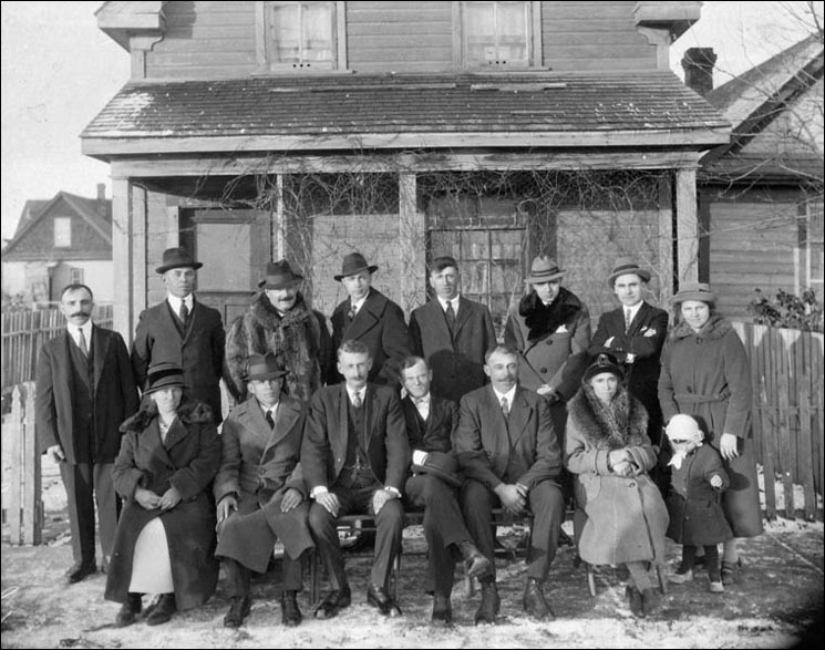 Hungarian immigrants: officers and members of King St.Stephen Roman Catholic Hungarian Sick Benefit Society in front of their office, Winnipeg, Manitoba, 1925